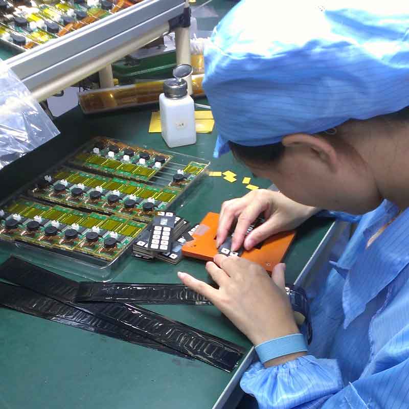 woman working on circuit board at work