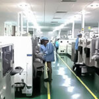 people standing in an assembly line