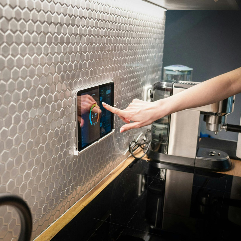 hand touching a touch screen device